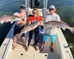 Image of group of anglers fishing from a boat in Tampa Bay