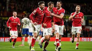 Wrexham survive! Red Dragons fend off Portsmouth fightback to keep hold of Championship play-off place