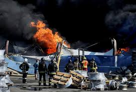 Russian attack on Ukrainian ammunition warehouse triggers waves of blasts, killing 37