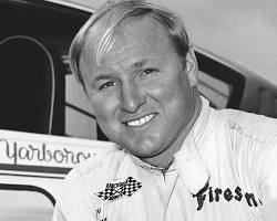 Image of Cale Yarborough commentating on a NASCAR race