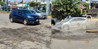 Lluvias exhiben fracaso millonario de “Tache al Bache”; reaparecen hoyancos en Oaxaca capital