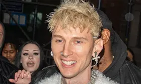 Machine Gun Kelly shows off blackout arm tattoo in fuzzy vest following show in NY... after Megan Fox confirme