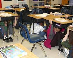 Image of people practicing earthquake drills