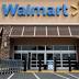 Wal-Mart lowers forecast as earnings fall