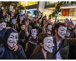 Image of Protesters wearing Guy Fawkes masks
