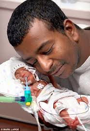 Miracle: Mahmoud Soliman with his baby daughter Aya Jayne who was born two days after her mother died. Born by Caesarean section eight days ago - two days ... - article-0-03155454000005DC-34_468x683