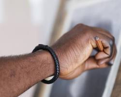 Image of man wearing a stylish leather bracelet