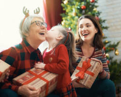 person giving a gift to their grandparentsの画像