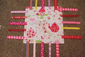 Résultat de recherche d'images pour "taggy blanket"