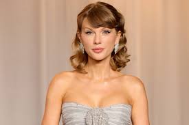 Taylor Swift wearing a floral velvet minidress at the Nashville Songwriters Hall of Fame Gala 2026