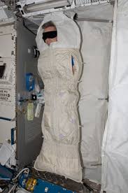 Image result for an astronaut sleeping in space