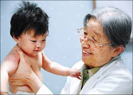 Dr. Cho Byung-kuk checks a baby at the Holt Children&#39;s Service Pediatric Clinic. Cho first became involved with Holt Children&#39;s Services in 1958 while ... - 2008103061009_0