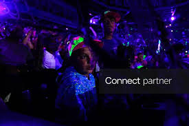 Licensable picture: Fans look out as the black lights are turned on during the Cosmic Baseball game at Huntington Park on July 24, 2026 in Columbus