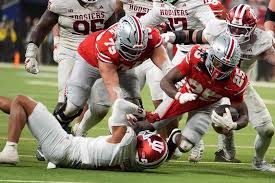 Indiana\'s Amare Ferrell stops Ohio State\'s Bo Jackson during the second half of the Big Ten championship NCAA college football game in Indianapolis, Saturday, Dec. 6, 2025.