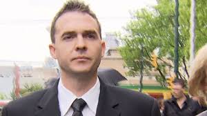 Former Vancouver police officer Peter Hodson leaves Vancouver provincial court after pleading guilty to trafficking marijuana and breaching the public trust ... - image
