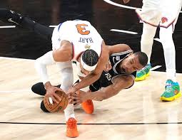 New York\'s Josh Hart steals the ball from San Antonio\'s Victor Wembanyama during Game 1 of the NBA Finals on Wednesday night.