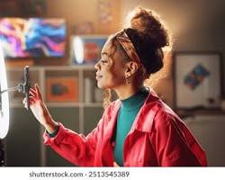 Image of content creator at home studio with ring light microphone and laptop creative economy concept photo reference