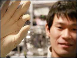 Koji Usami shows the holder with the semiconductor nanomembrane. The holder measures about one cm. Niels Bohr Institute - 201201225904442