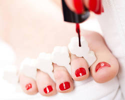 Image of Applying nail polish to toenails
