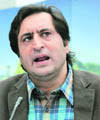 Sajjad Ghani Lone addresses mediapersons at his residence in Srinagar on Saturday. Srinagar, April 11 - jk3