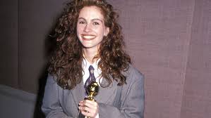 Julia Roberts stunning in a tailored suit, representing her iconic fashion statement.