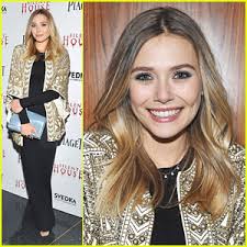 Elizabeth Olsen smiles at the premiere of her new thriller, Silent House, on Tuesday (March 6) at AMC Loews Lincoln Square in NYC. - elizabeth-olsen-silent-house