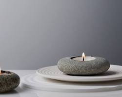 Image of set of votive candles shaped like pebbles, perfect for a Zen garden theme