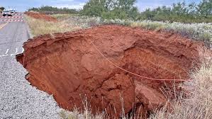TxDOT says it will take 400 dump truck loads to fill Texas-sized sink hole in Cottle Co.