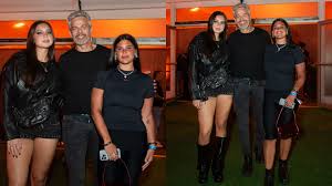 Filha caçula de Flávia Alessandra chama atenção pela altura ao lado de Otaviano Costa, no Rock in Rio