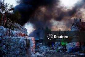 Rescuers work at the site of a Russian missile strike, amid Russia's attack on Ukraine, in Kyiv