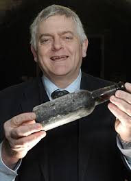 Vintage: Brewer John Bexon proudly shows a 75-year-old ale which never went on sale because it was brewed to celebrate the coronation of Edward VIII - article-2088909-0F86DABE00000578-297_306x423