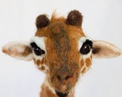 Image of giraffe body and head being needle felted