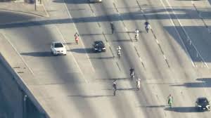 Motorcyclists pop wheelies dangerously close to L.A. driver in high-speed pursuit