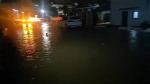 AEMET Dana Adam 2026 flooding in Valencia with rescue workers on rooftops during torrential rain