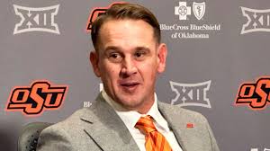 New Oklahoma State coach Eric Morris shoots armadillo in yard