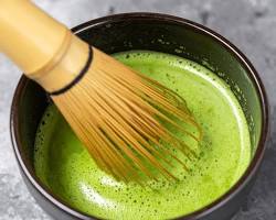 vibrant green matcha whisked in chawan bowl with chasen bamboo whisk tea ceremony aesthetic, do AI tạo
