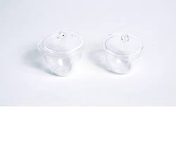 Image of tall form glass crucible with a lid