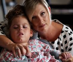 Three years on, Saba still has regular seizures and requires constant medical care. a_140413genbutton1_18t5o29-18t5o2d. Her parents Mick and Kirsten Button ... - a_140413genbutton1_18t5o29-18t5o2d1