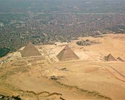 Image of pyramids from a distance, showcasing their size and scale