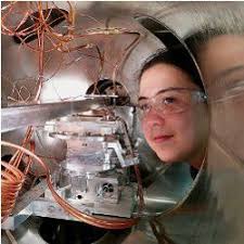 Argonne National Laboratory chemist Karena Chapman peers inside the vacuum tank of the new high-energy Si Laue monochromator recently installed in the ... - 062014_CACMpg13_Big-Data-Meets1.large