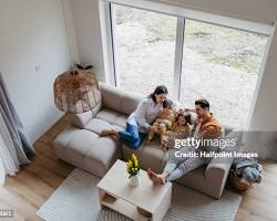 family enjoying their new furniture at homeの画像