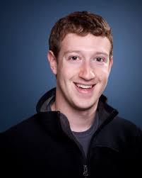 Mark Zuckerberg ahead Facebook's logo