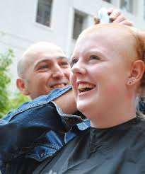 BUZZING ALONG: April Bliss gets her head shaved by Hairdresser Georgie Love on Lambton Quay last Friday. - 6600432