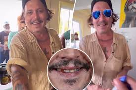 Johnny Depp flashes new pearly whites after his ‘rotting’ teeth went viral