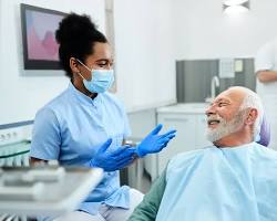 Image of Dental assistant preparing patient