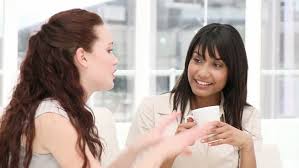 Image result for Photo of a woman talking at office working as a group