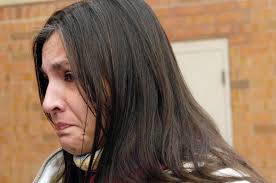 inside the Weld County Courthouse in Greeley on Dec. 21, 2007. (Greeley Tribune / Riza Falk). Dana Trujillo holds back tears as she speaks to the media ... - dana-trujillo