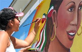 Maria Alvarado is a UC Davis student in Chicana/o studies professor Malaquias Montoya&#39;s class who is creating art at Beamer Elementary School in Woodland. - mural_beamer_lg