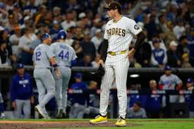 Wild throw in ninth inning allows Dodgers to even series with Padres