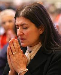 Kate Weber-Choals of the Cathedral of St. Paul prays during the prayer service. - Prolife2